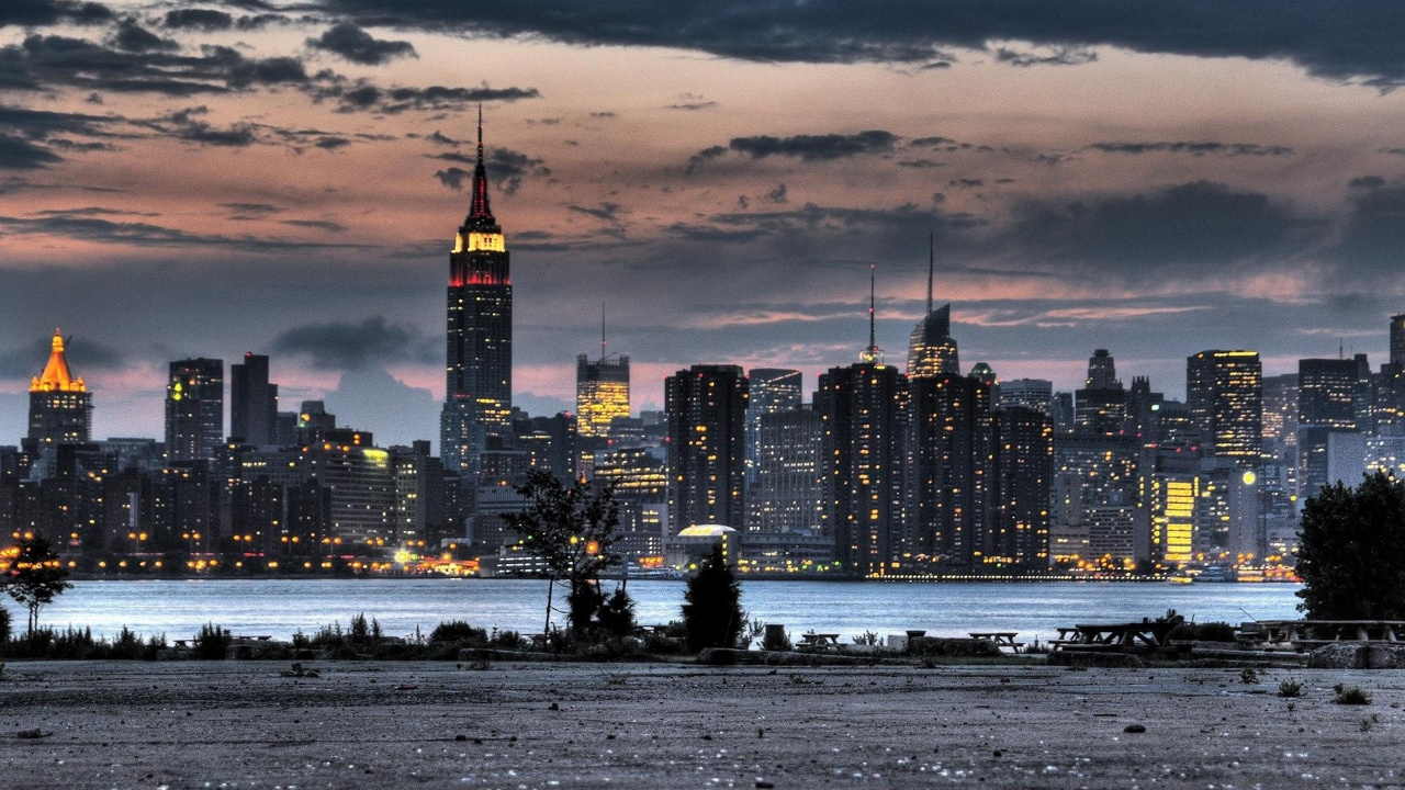 City Skyline Across Body of Water During Night Time. Wallpaper in 1280x720 Resolution