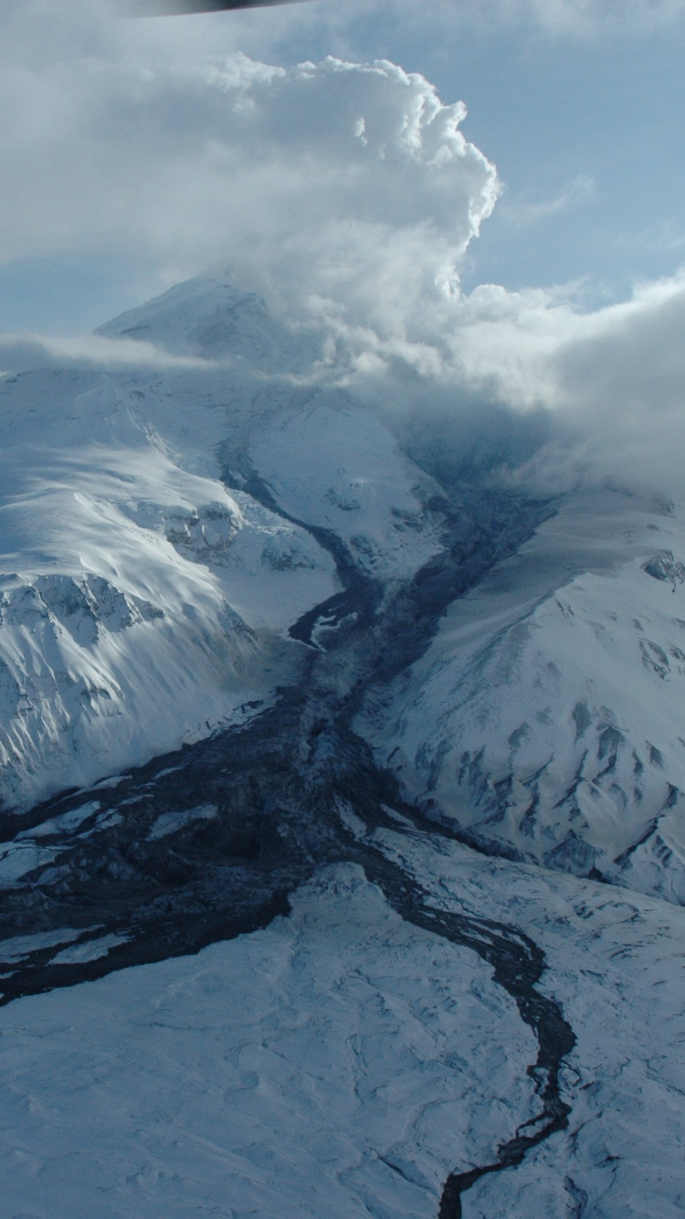 Snow Covered Mountain Under White Clouds During Daytime. Wallpaper in 750x1334 Resolution