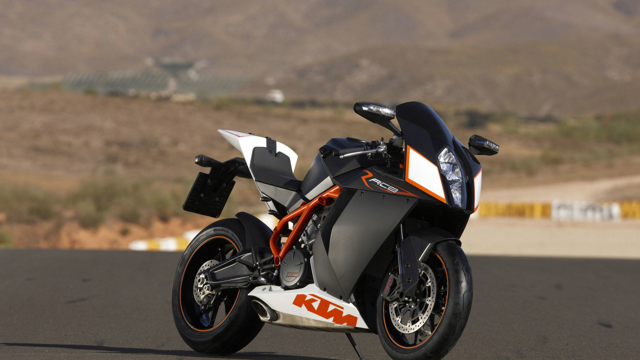 Vélo de Sport Noir et Orange Sur Route Pendant la Journée. Wallpaper in 1280x720 Resolution