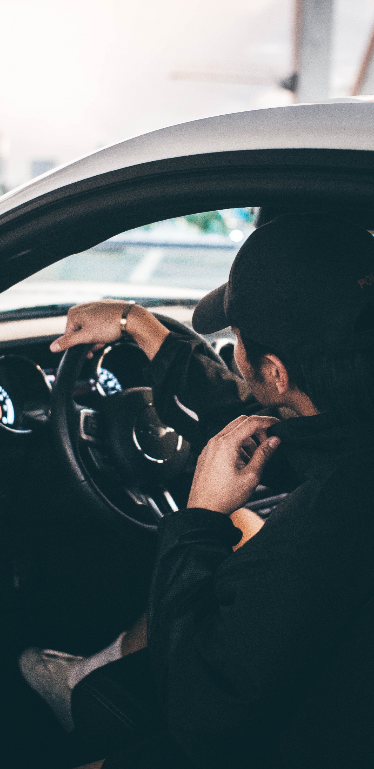 Man in Black Jacket Driving Car During Daytime. Wallpaper in 1440x2960 Resolution