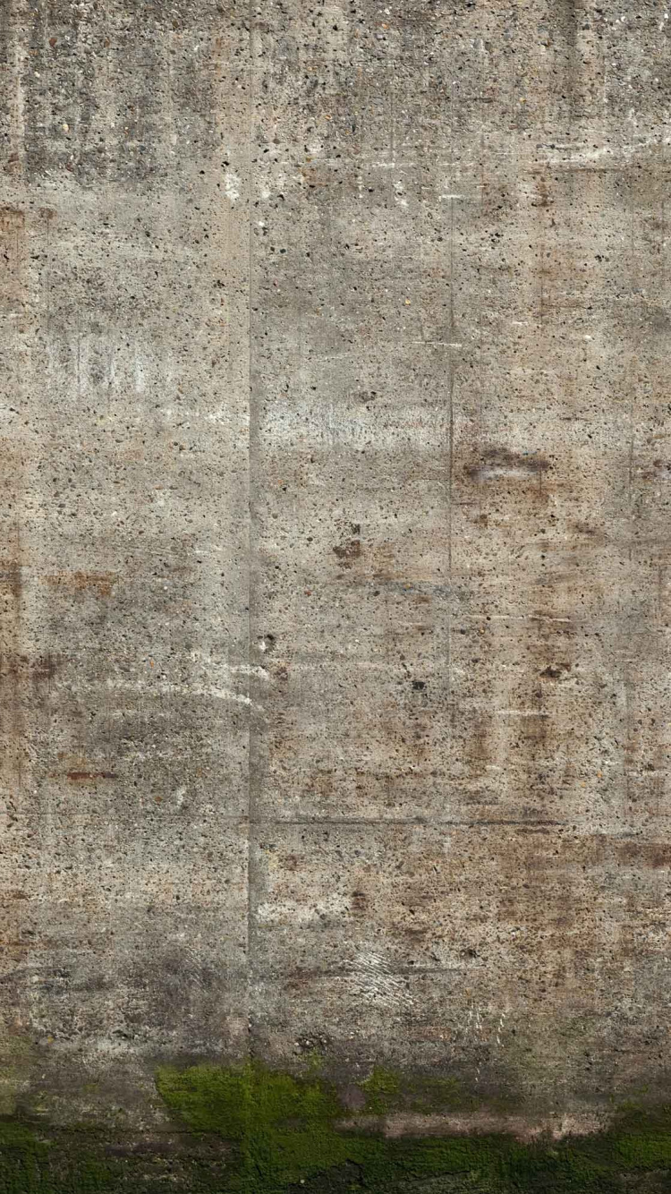 Green Grass Field Near Gray Concrete Wall. Wallpaper in 750x1334 Resolution