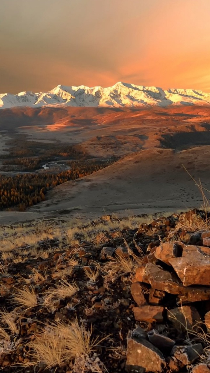 Brown and Gray Rocky Mountain Under White Cloudy Sky During Daytime. Wallpaper in 720x1280 Resolution
