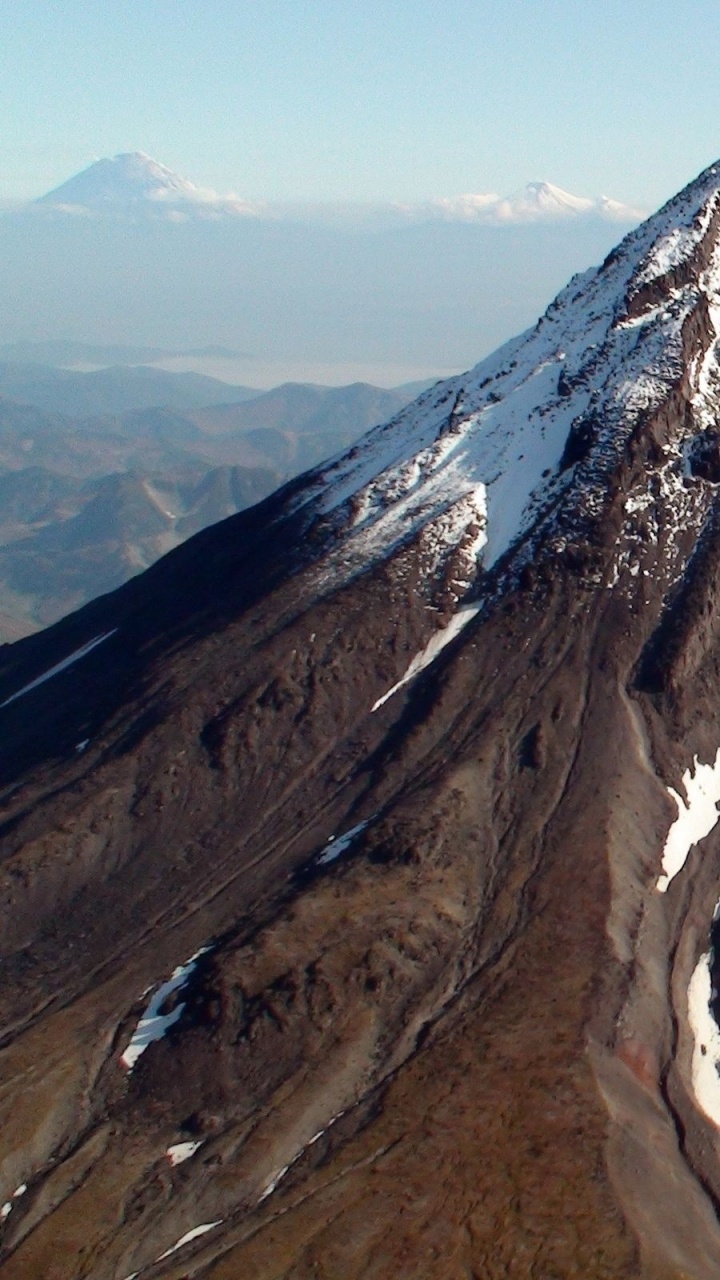Brown and White Mountain Under Blue Sky During Daytime. Wallpaper in 720x1280 Resolution