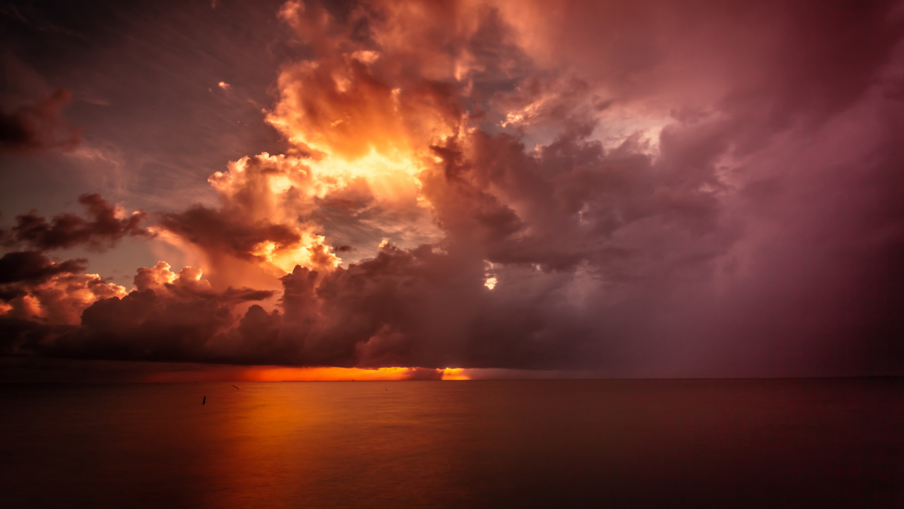 Body of Water Under Cloudy Sky During Sunset. Wallpaper in 1280x720 Resolution