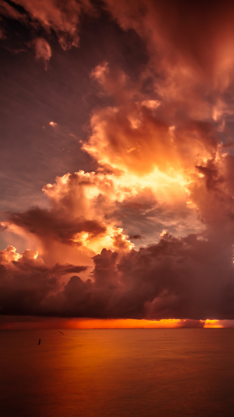 Body of Water Under Cloudy Sky During Sunset. Wallpaper in 750x1334 Resolution