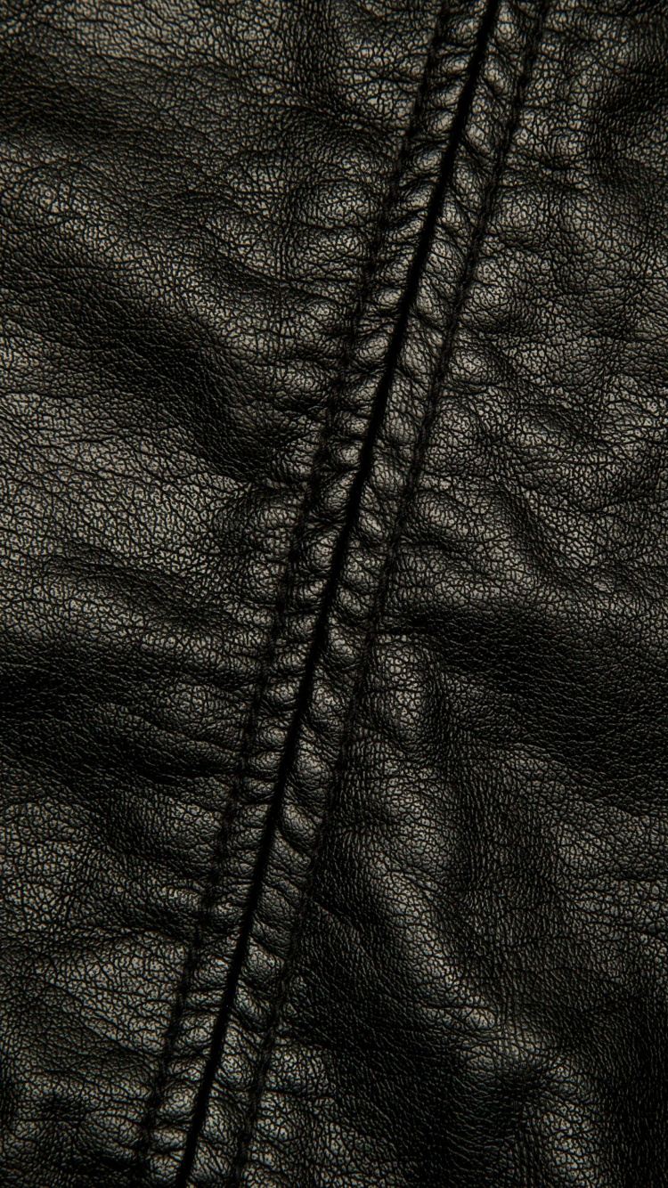 Veste Zippée Noire Sur Textile Blanc. Wallpaper in 750x1334 Resolution