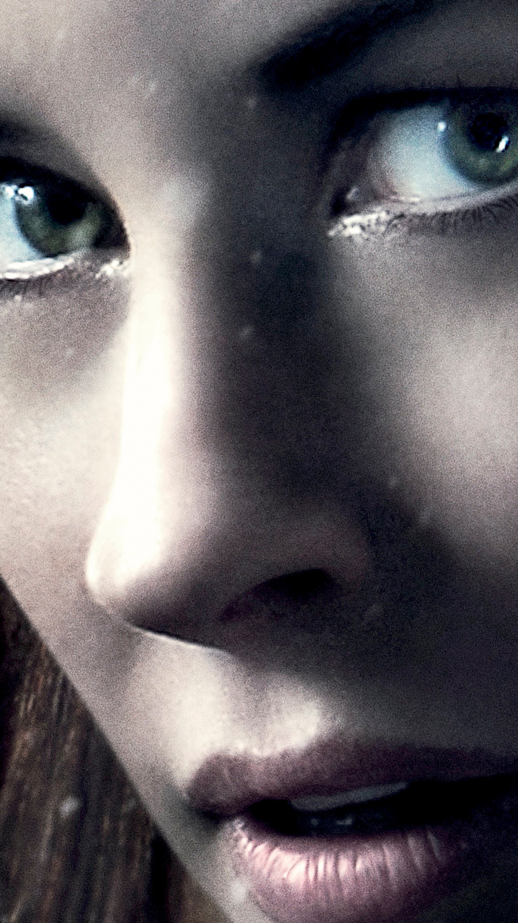 Woman With Blue Eyes and Black Hair. Wallpaper in 750x1334 Resolution