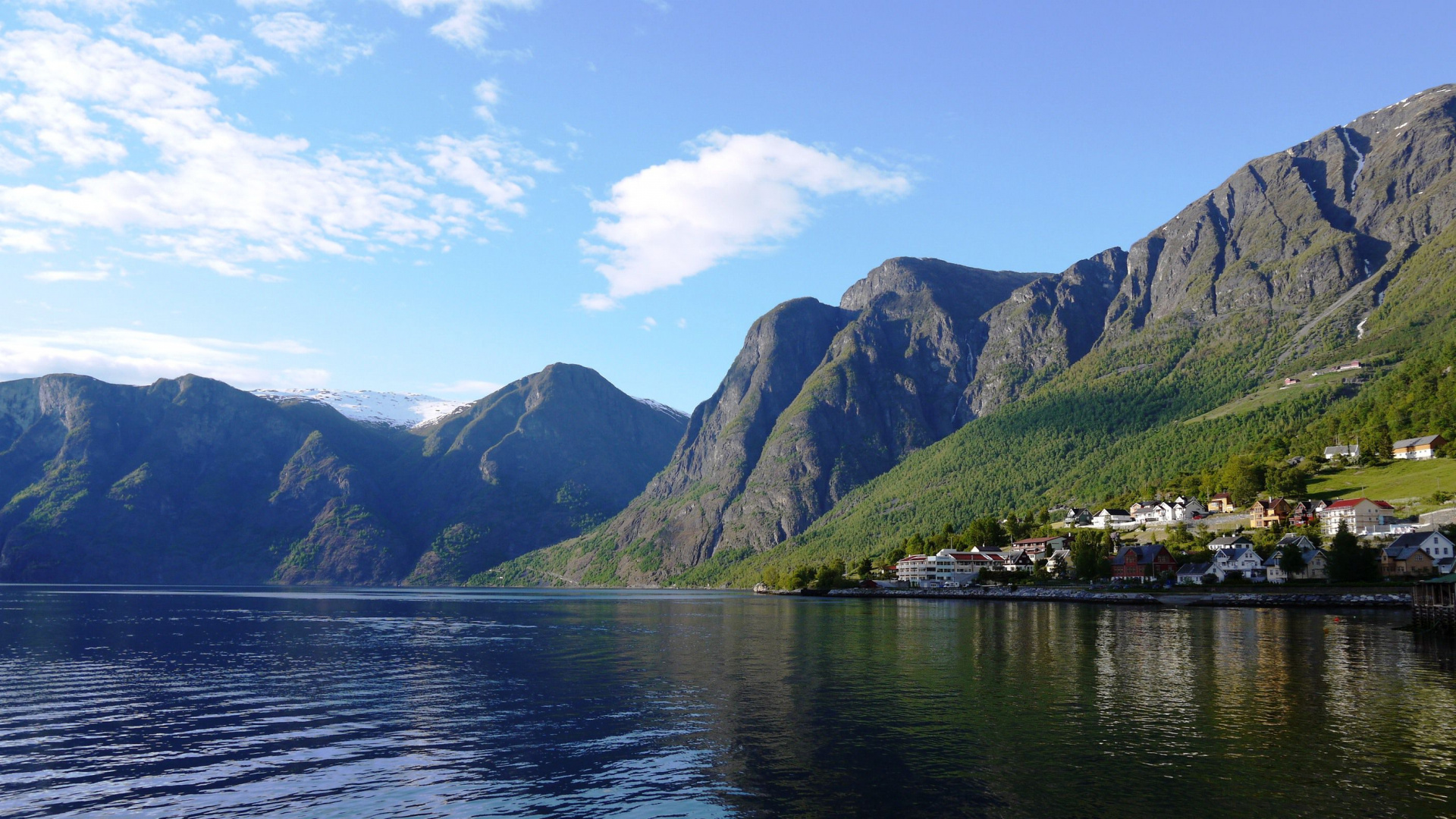Green Mountains Beside Body of Water Under Blue Sky During Daytime. Wallpaper in 1920x1080 Resolution