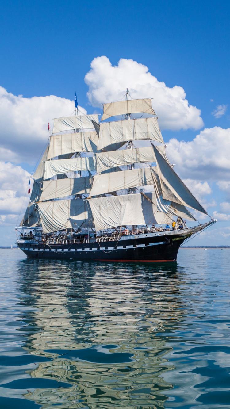 Brown and White Sail Ship on Sea Under Blue Sky During Daytime. Wallpaper in 750x1334 Resolution