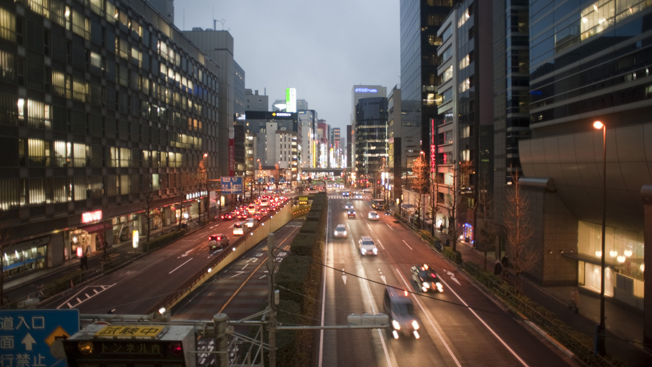 Cars on Road Between High Rise Buildings During Daytime. Wallpaper in 1280x720 Resolution