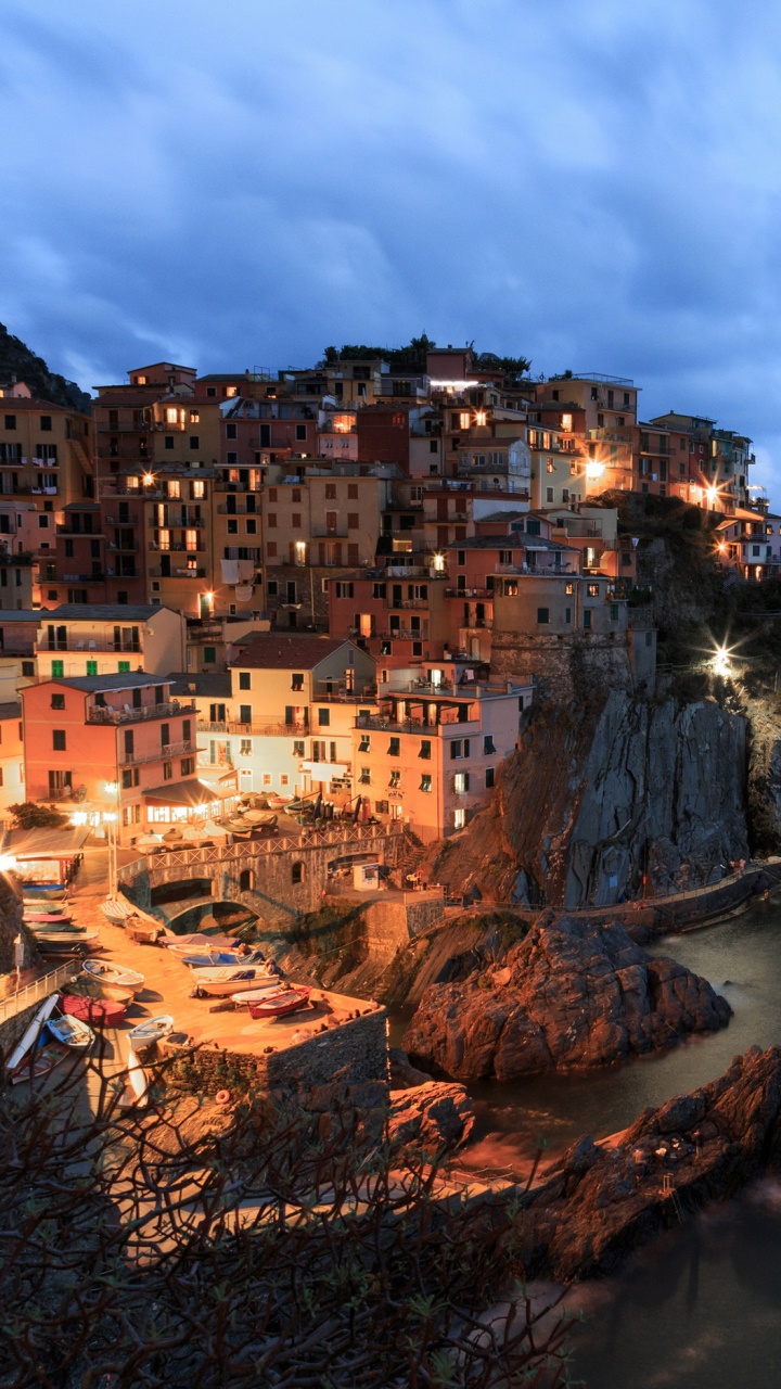 City Buildings on Cliff by The Sea Under White Clouds and Blue Sky During Daytime. Wallpaper in 720x1280 Resolution