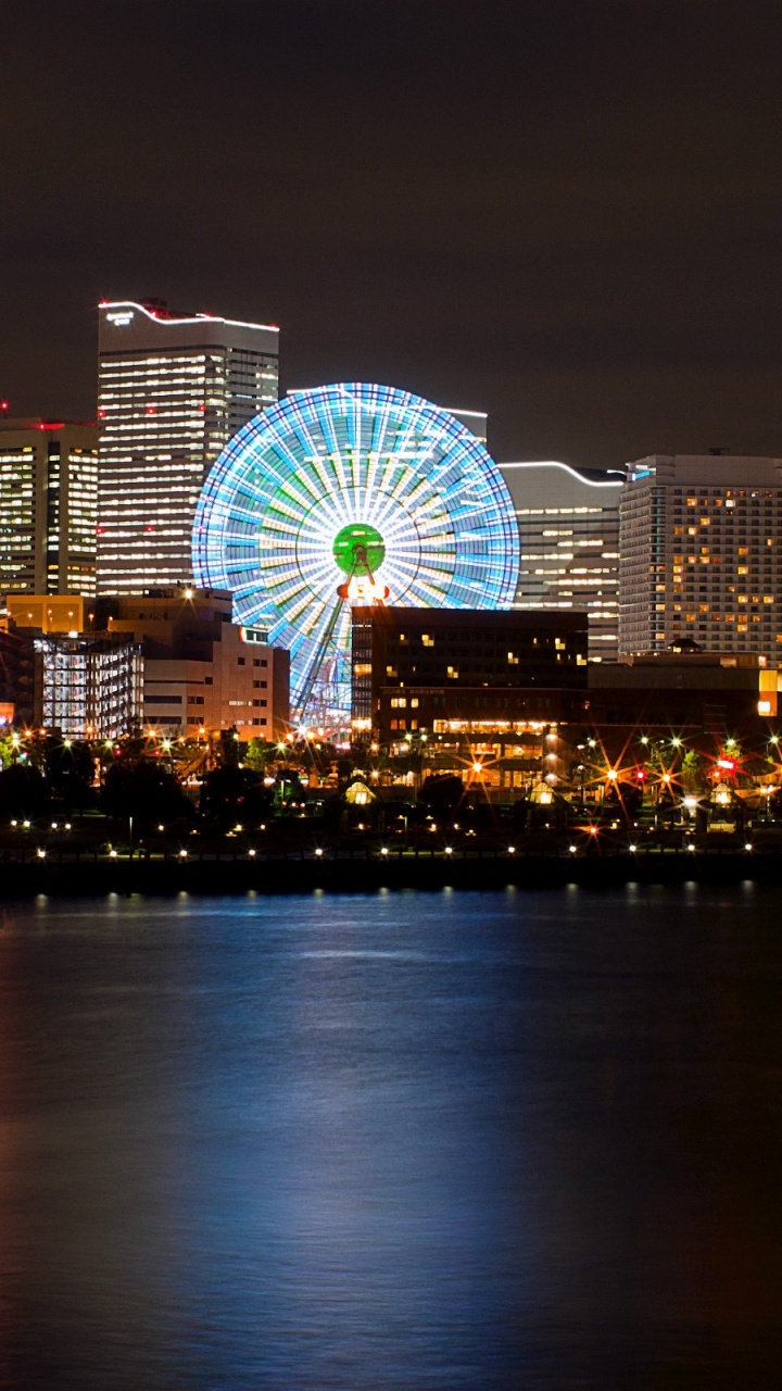 Ferris Wheel Near City Buildings During Night Time. Wallpaper in 720x1280 Resolution