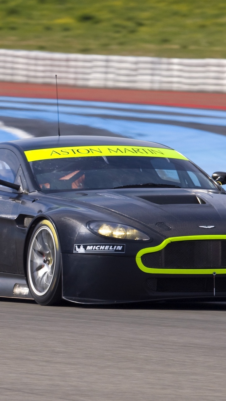 Schwarzer Porsche 911 Auf Der Strecke. Wallpaper in 720x1280 Resolution