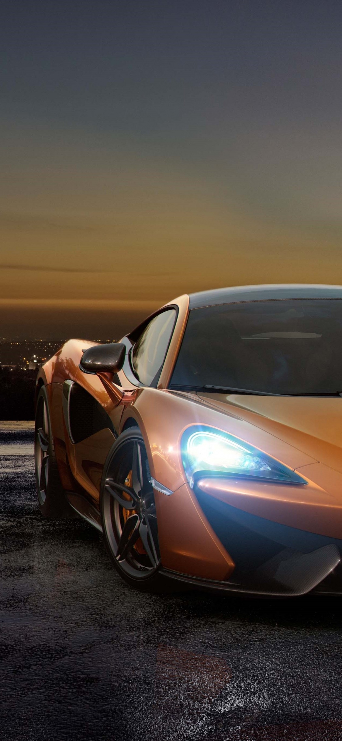 Yellow Lamborghini Aventador on The Beach During Night Time. Wallpaper in 1125x2436 Resolution