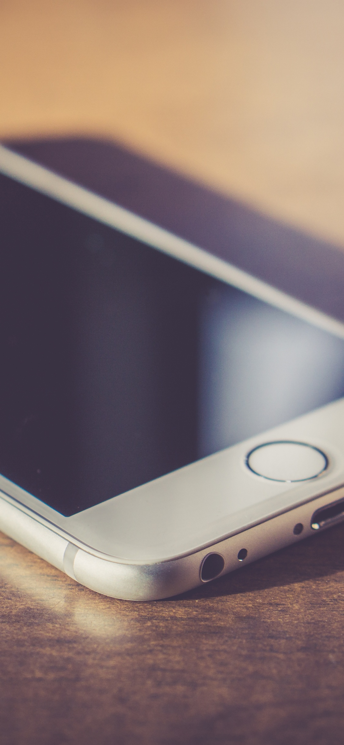 Gold Iphone 6 on Brown Wooden Table. Wallpaper in 1125x2436 Resolution