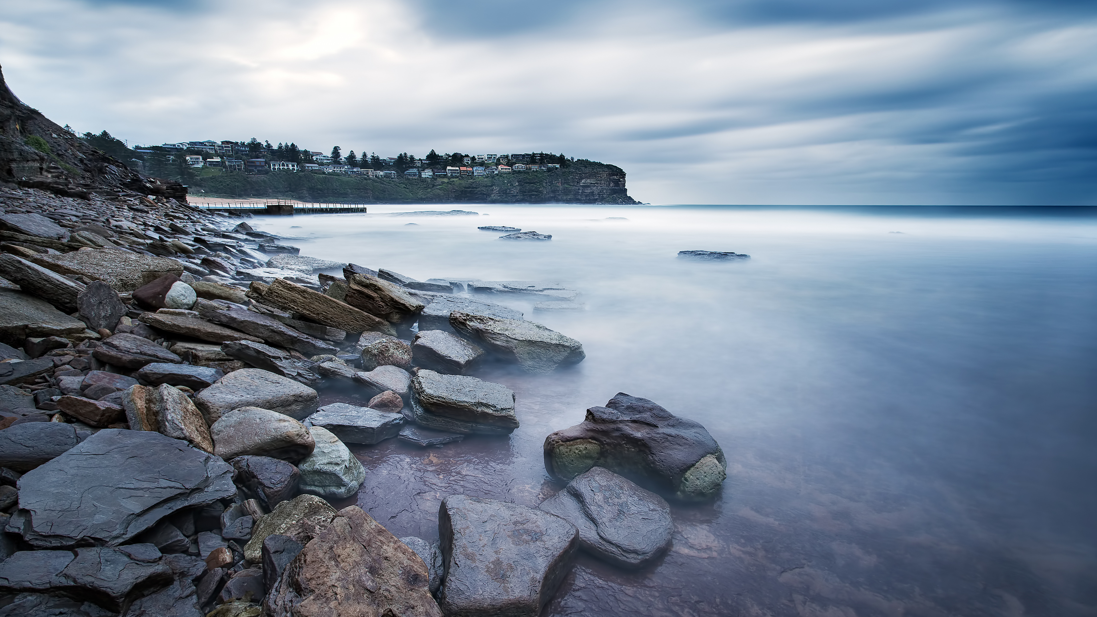 Brown and Green Rock Formation on Sea Shore During Daytime. Wallpaper in 3840x2160 Resolution