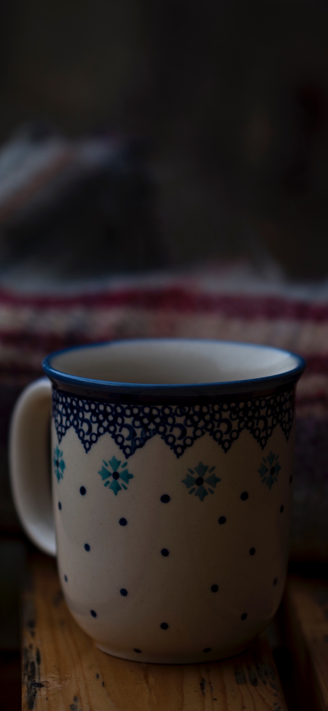 White and Blue Floral Ceramic Mug on Brown Wooden Table. Wallpaper in 1125x2436 Resolution