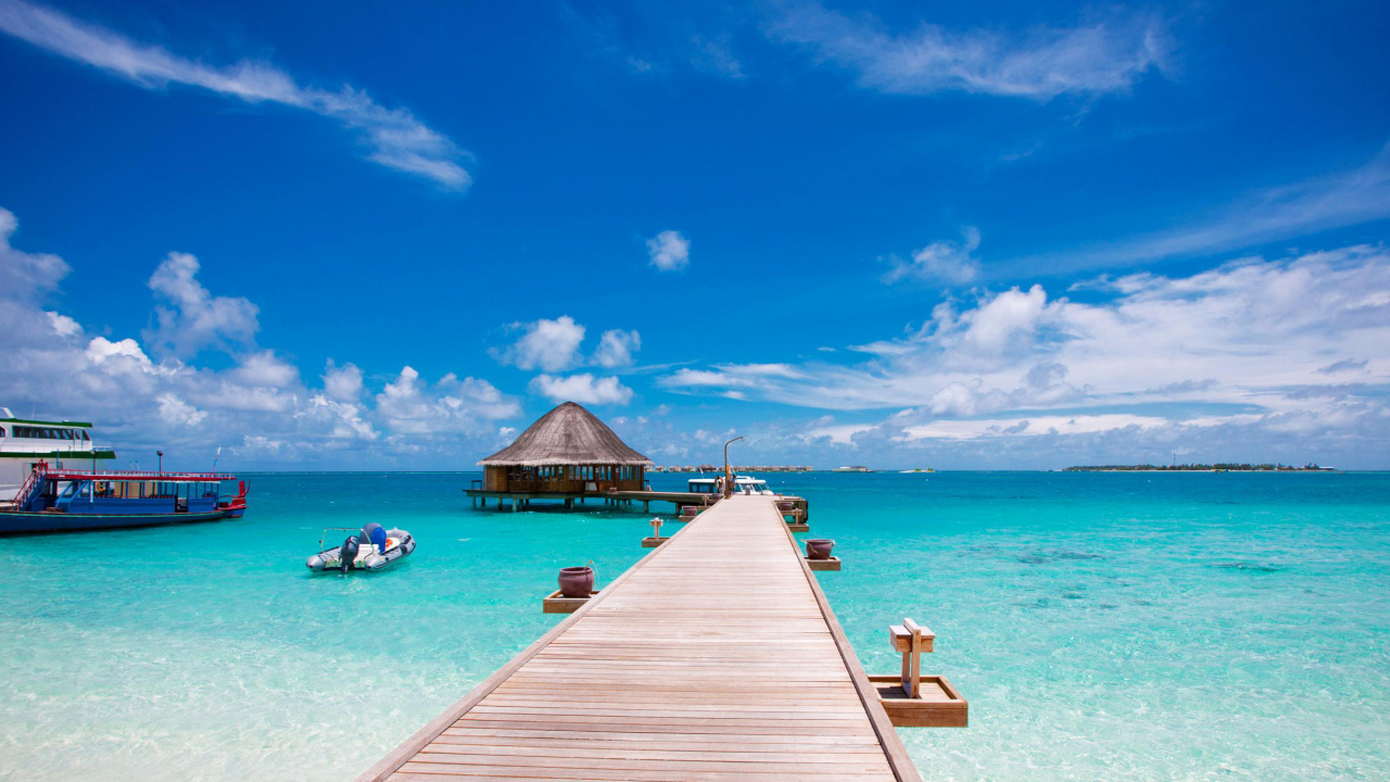 Brown Wooden Dock on Blue Sea Under Blue Sky During Daytime. Wallpaper in 1280x720 Resolution