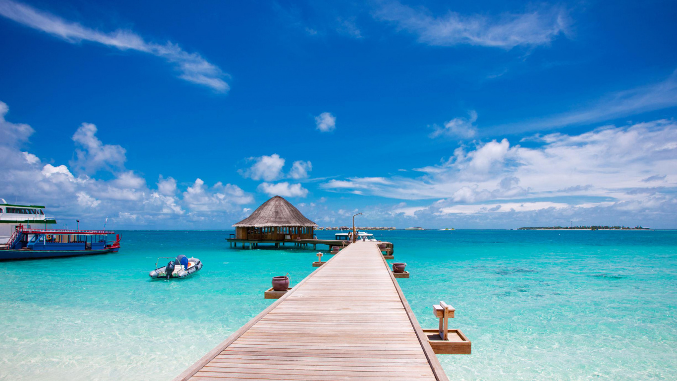 Brown Wooden Dock on Blue Sea Under Blue Sky During Daytime. Wallpaper in 1366x768 Resolution