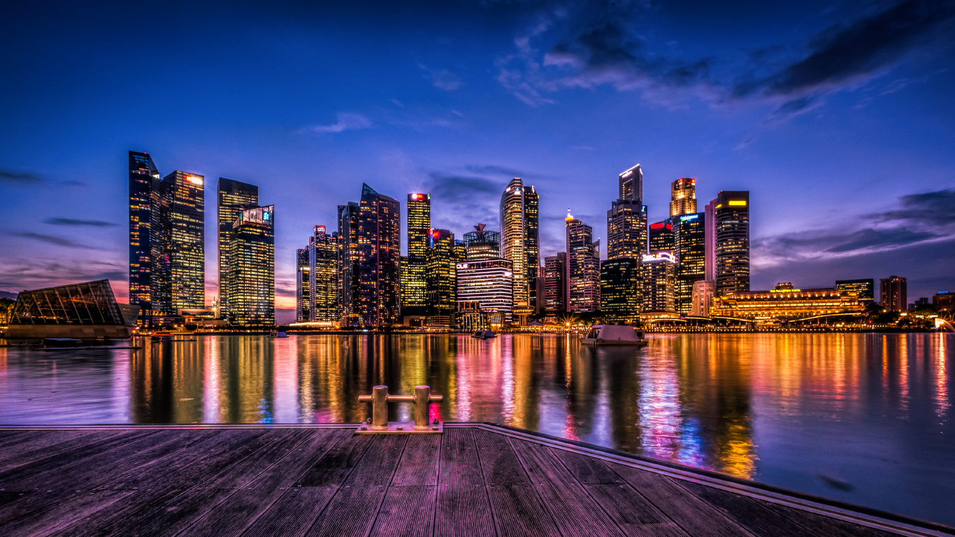 City Skyline Across Body of Water During Night Time. Wallpaper in 1366x768 Resolution