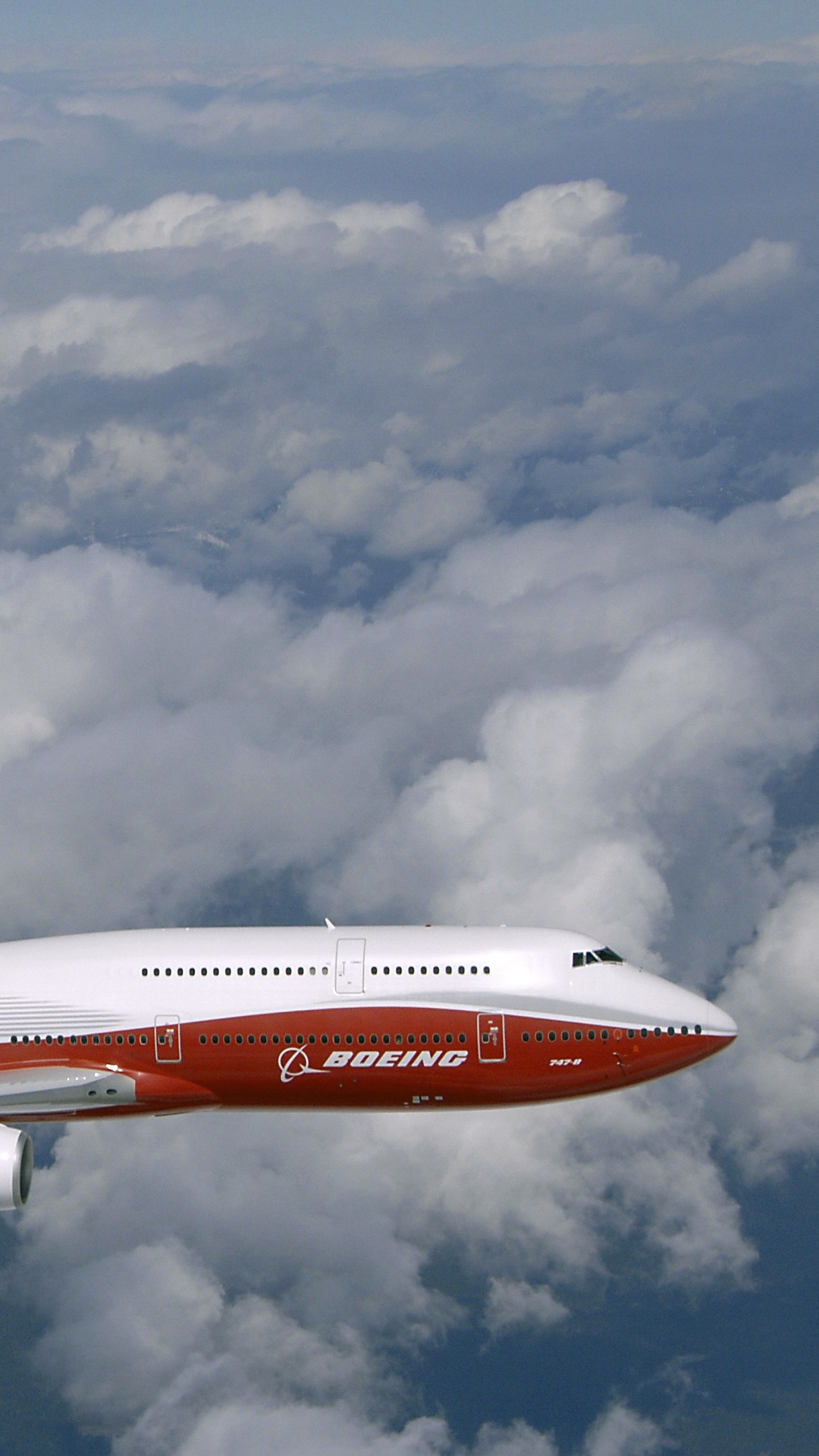 White and Red Airplane Flying Under Cloudy Sky During Daytime. Wallpaper in 1080x1920 Resolution