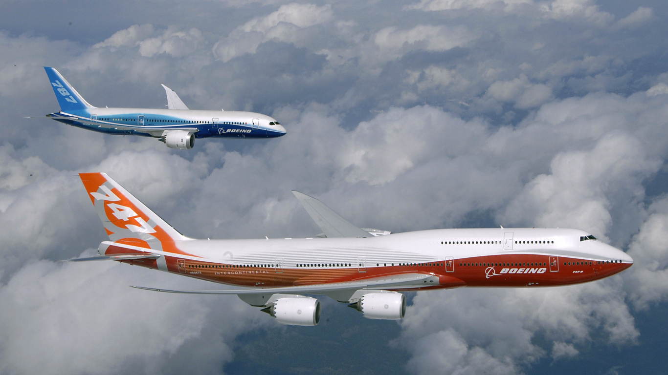 Avion Blanc et Rouge Volant Sous un Ciel Nuageux Pendant la Journée. Wallpaper in 1366x768 Resolution