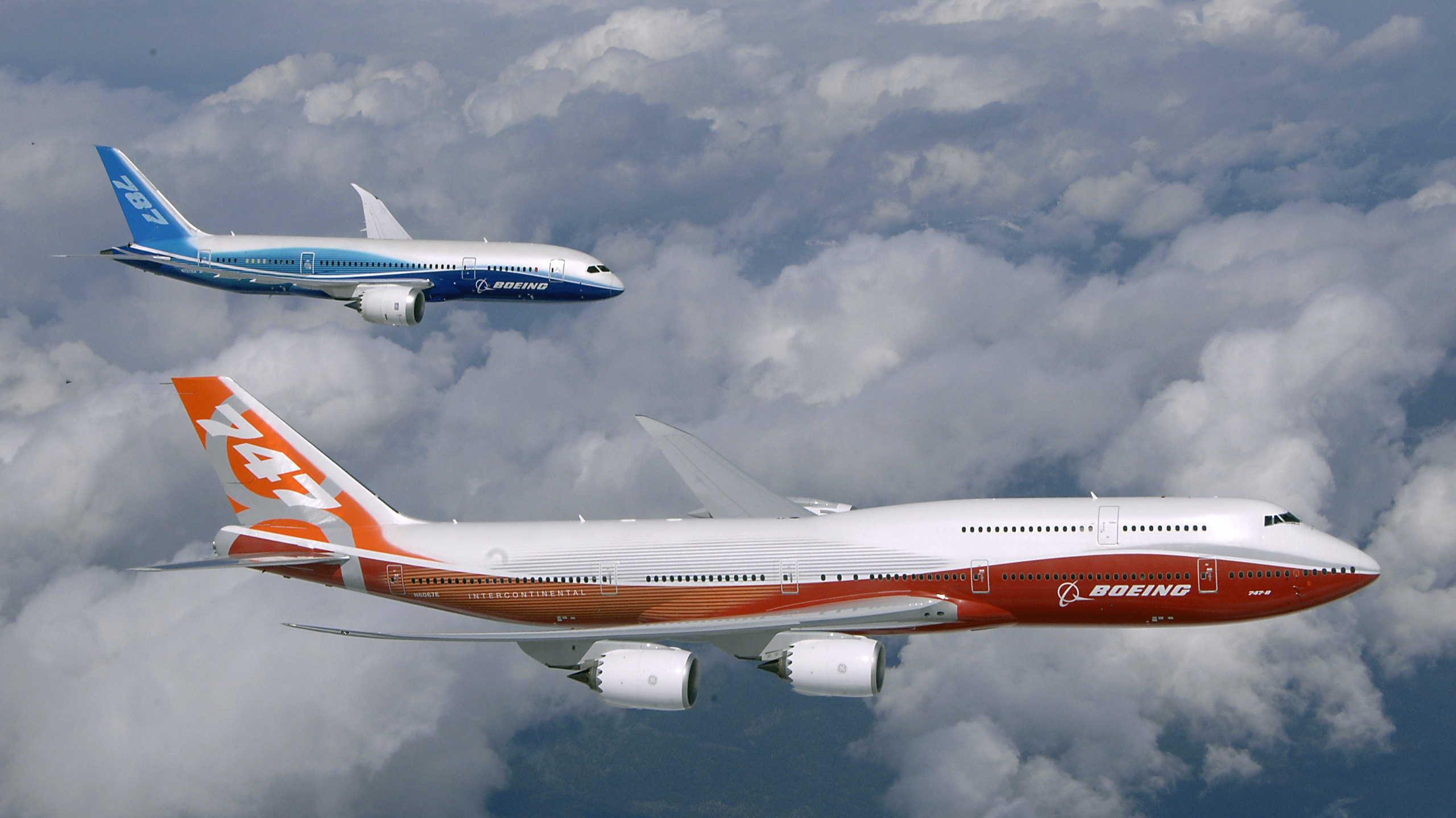 Avion Blanc et Rouge Volant Sous un Ciel Nuageux Pendant la Journée. Wallpaper in 2560x1440 Resolution