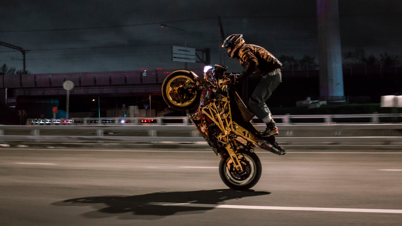 Man in Black Jacket Riding on Yellow Motorcycle. Wallpaper in 1280x720 Resolution
