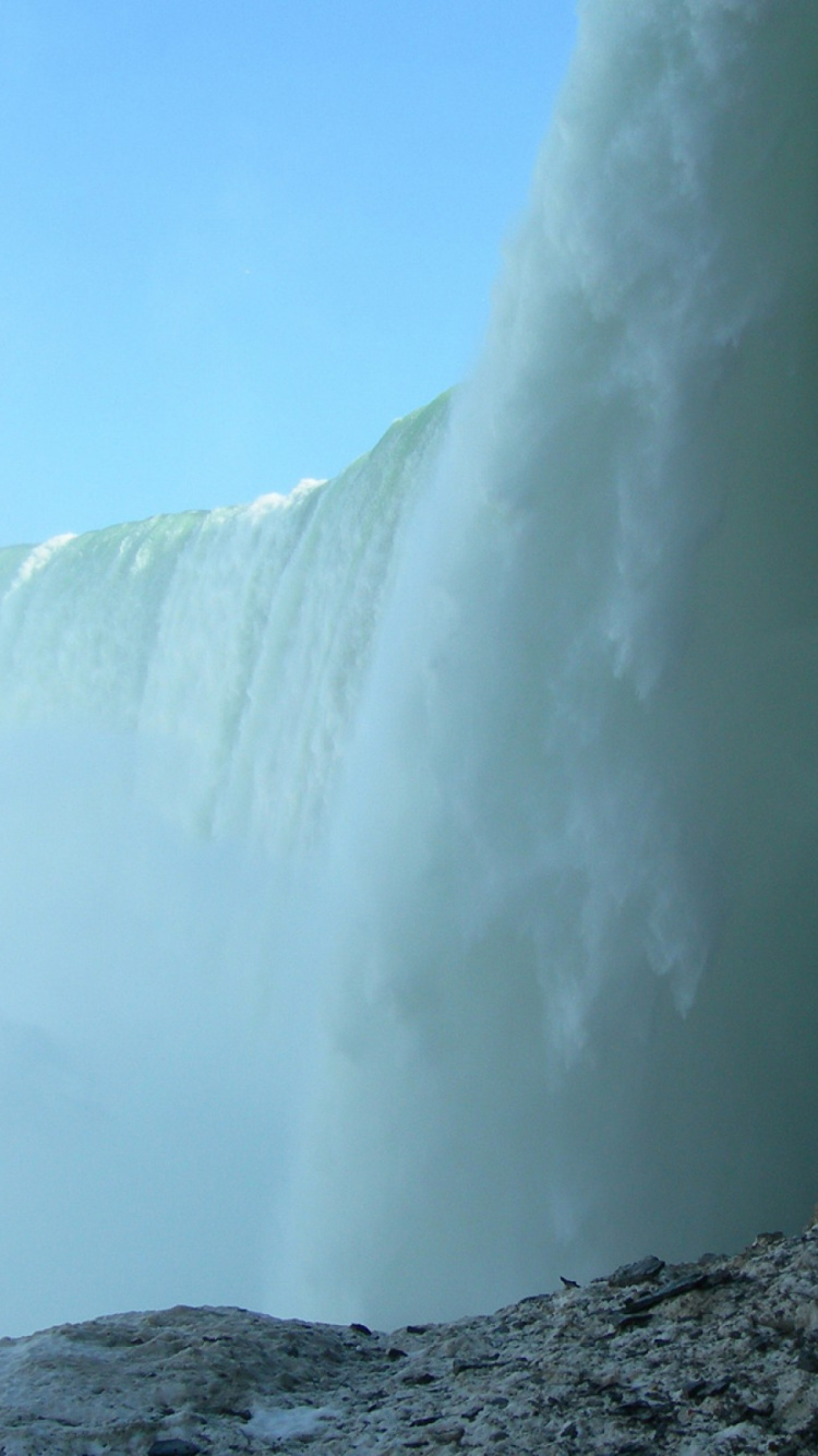 Waterfalls Under Blue Sky During Daytime. Wallpaper in 750x1334 Resolution