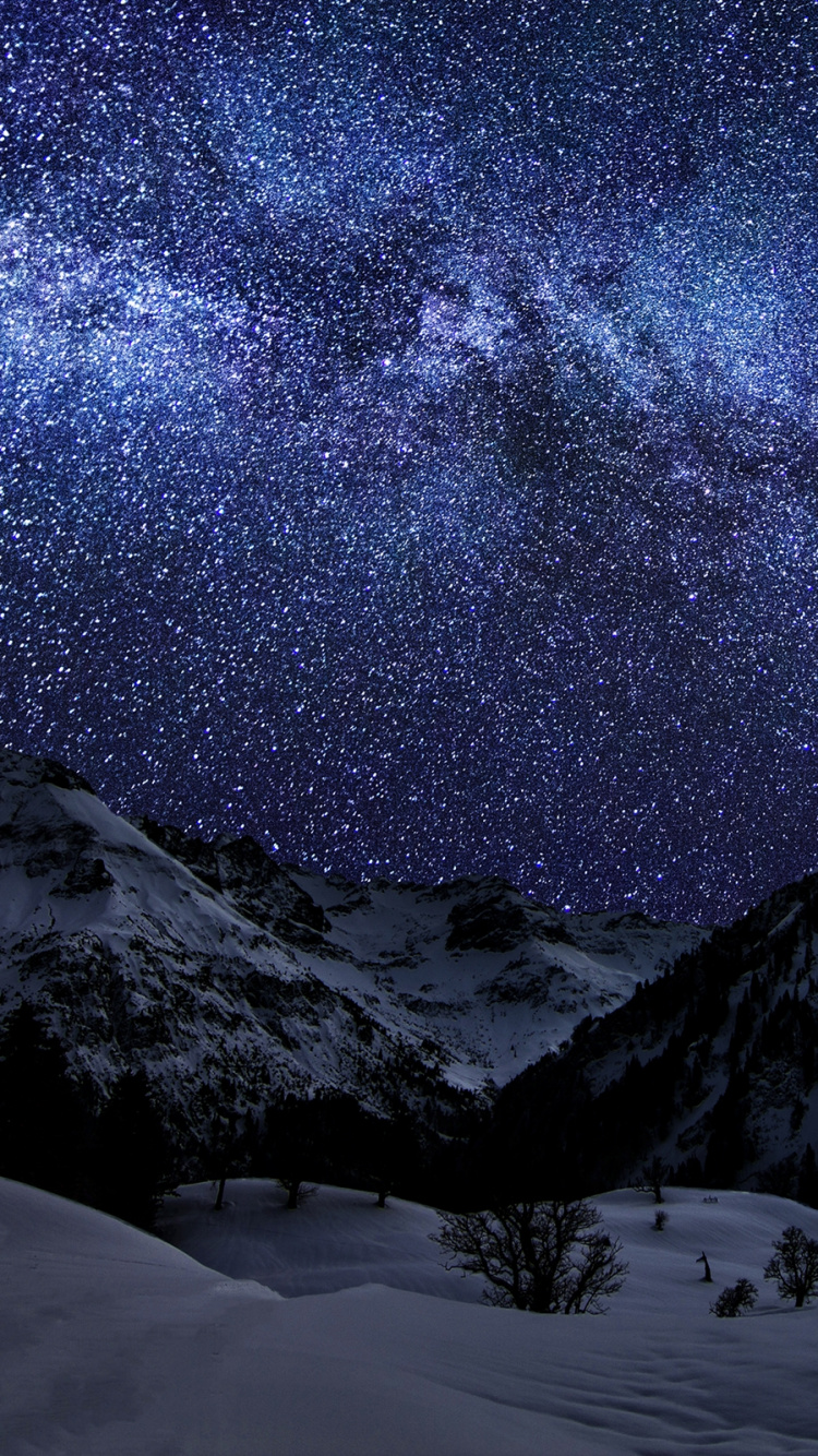 Snow Covered Mountain Under Starry Night. Wallpaper in 750x1334 Resolution