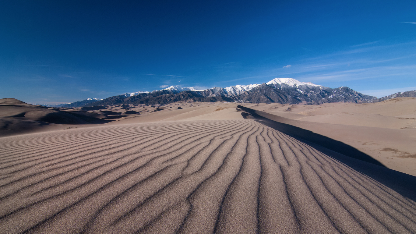 Brown Sand Under Blue Sky During Daytime. Wallpaper in 1366x768 Resolution