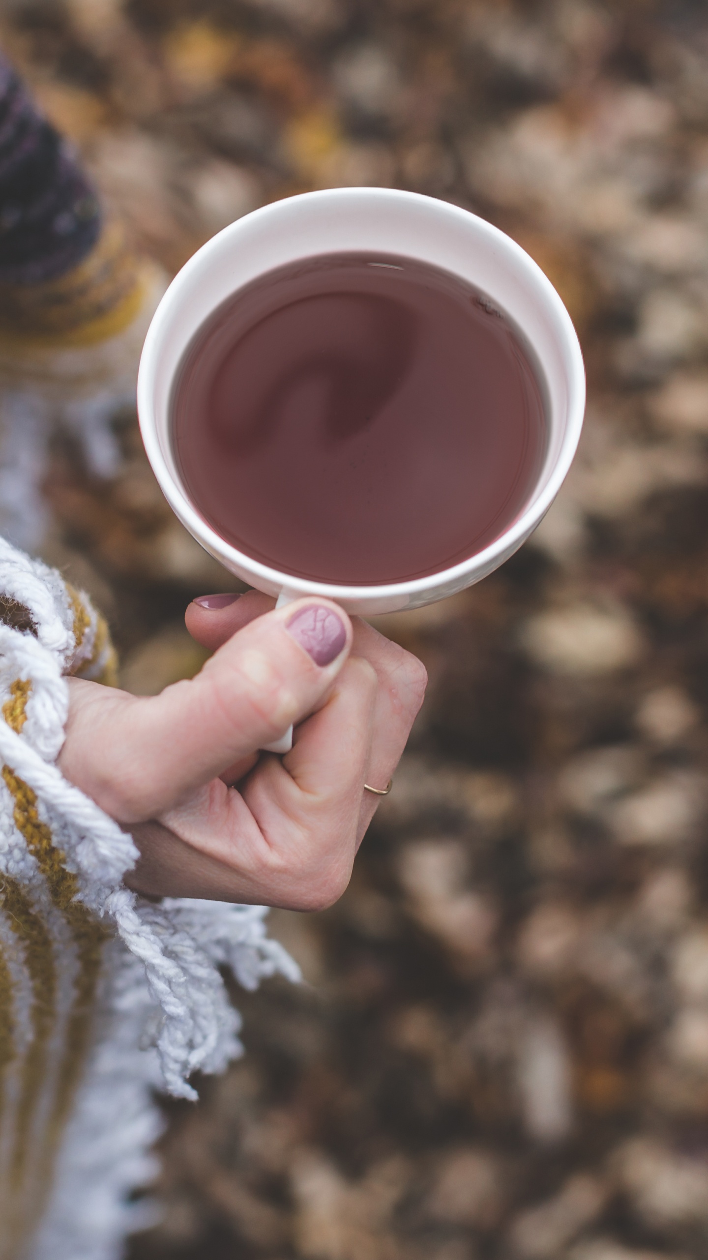 Person Holding White Ceramic Mug With Brown Liquid. Wallpaper in 1440x2560 Resolution