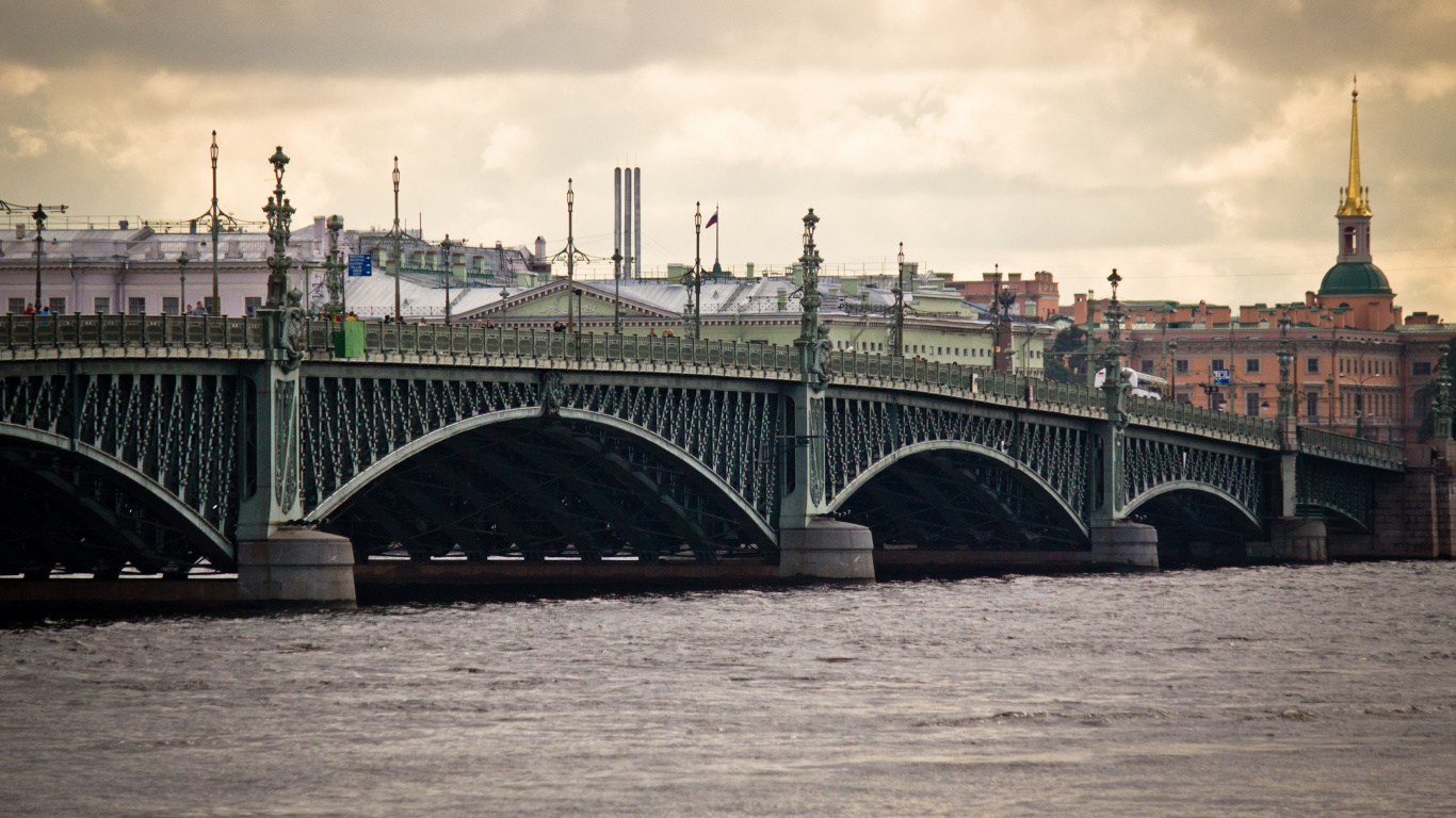 Gray Concrete Bridge Over Body of Water Under Cloudy Sky During Daytime. Wallpaper in 1366x768 Resolution
