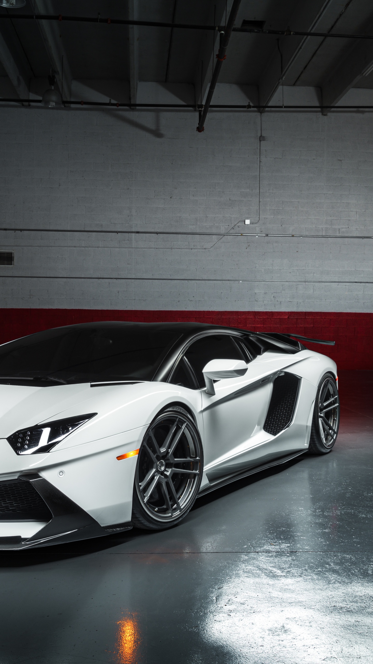 White and Black Porsche 911 Parked in Garage. Wallpaper in 1440x2560 Resolution