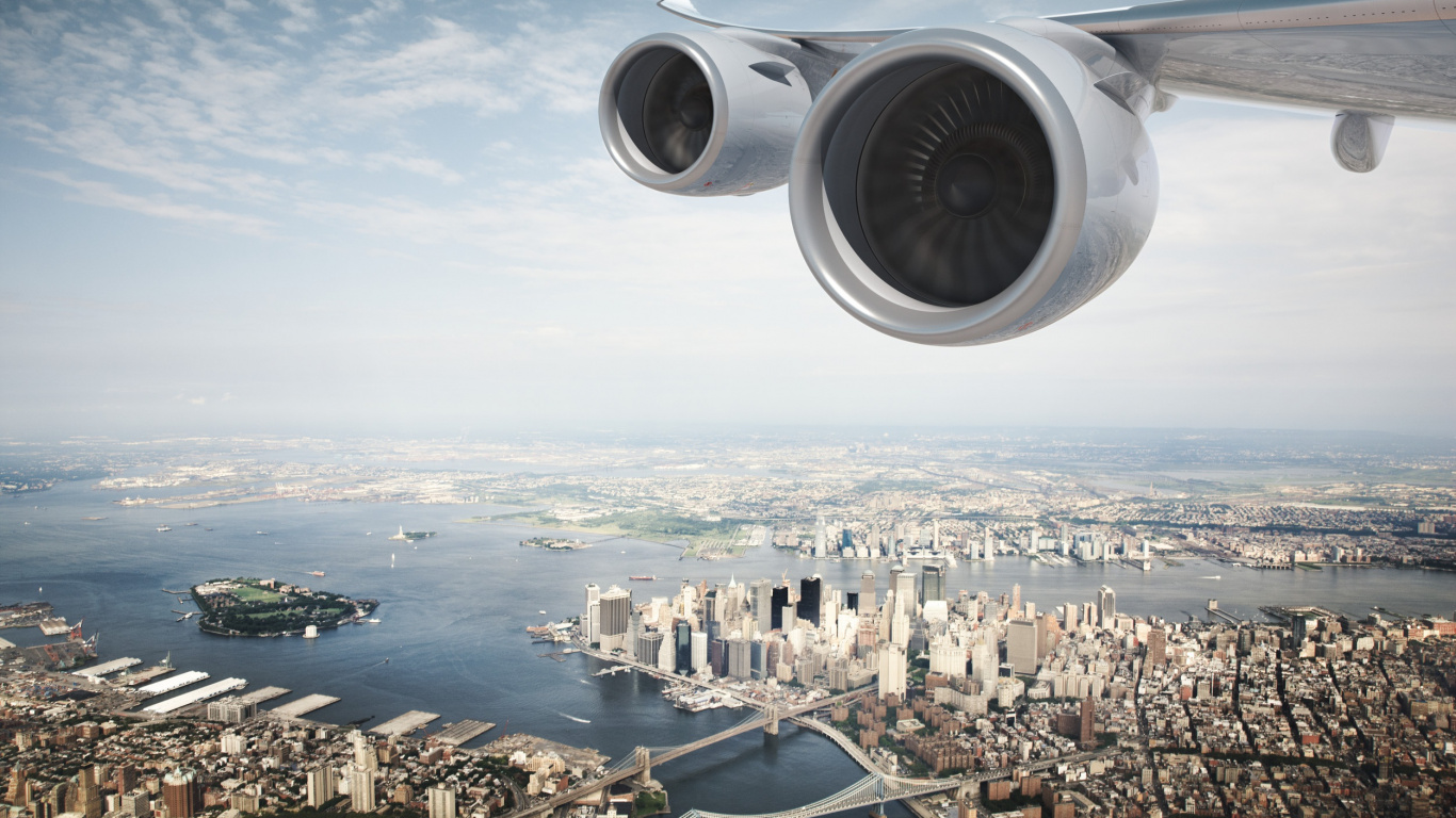 White and Gray Airplane Wing Over City Buildings During Daytime. Wallpaper in 1366x768 Resolution