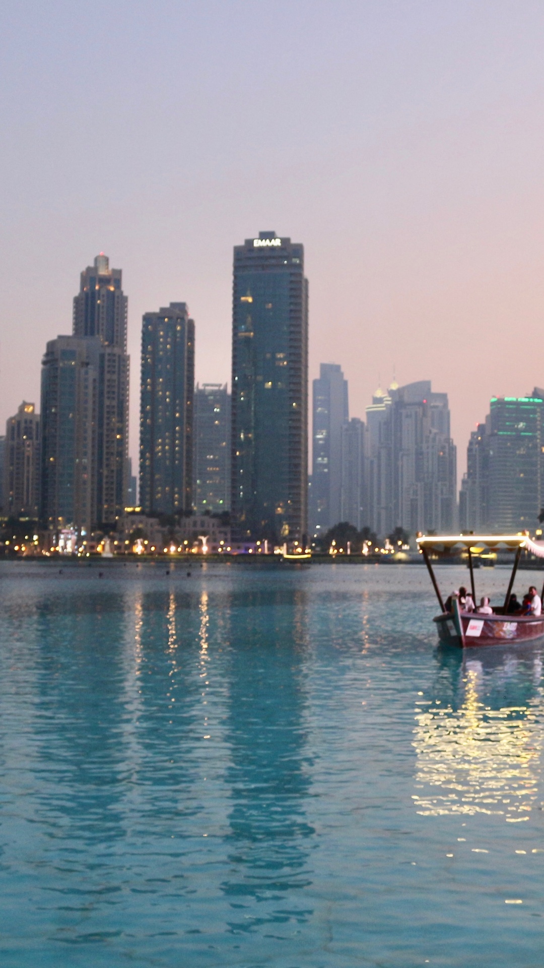 Red Boat on Body of Water Near City Buildings During Daytime. Wallpaper in 1080x1920 Resolution