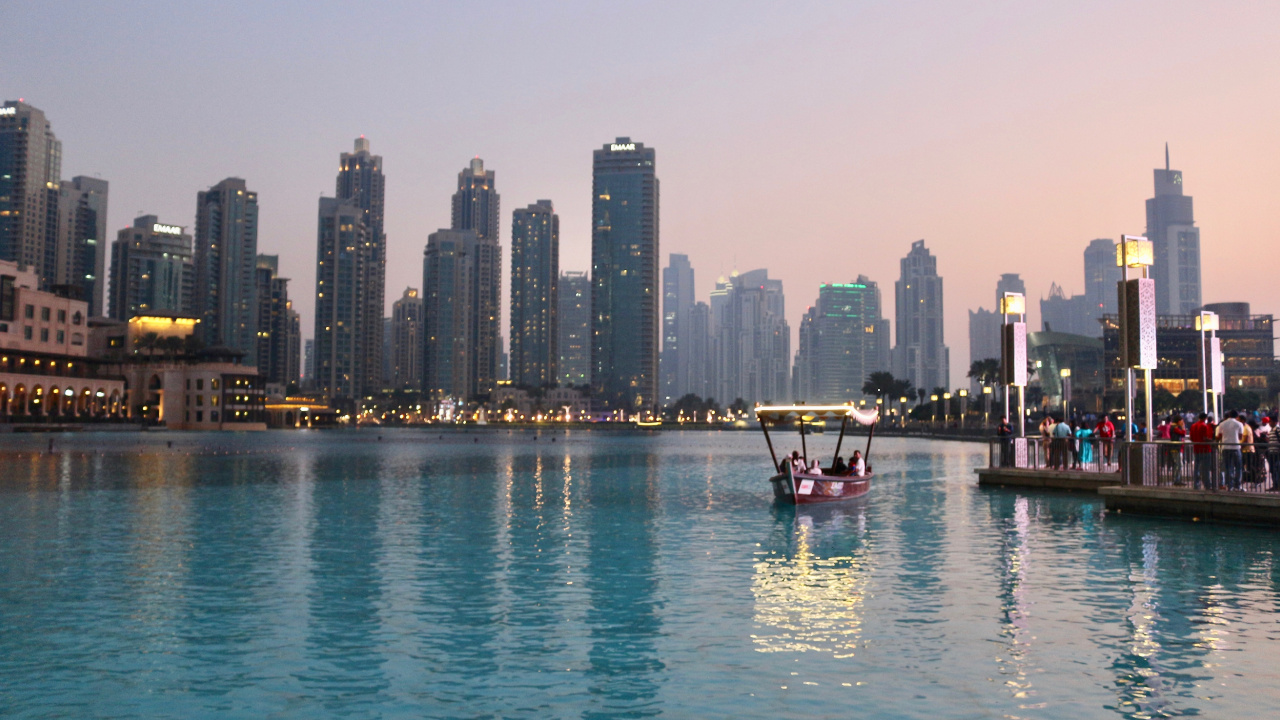 Red Boat on Body of Water Near City Buildings During Daytime. Wallpaper in 1280x720 Resolution