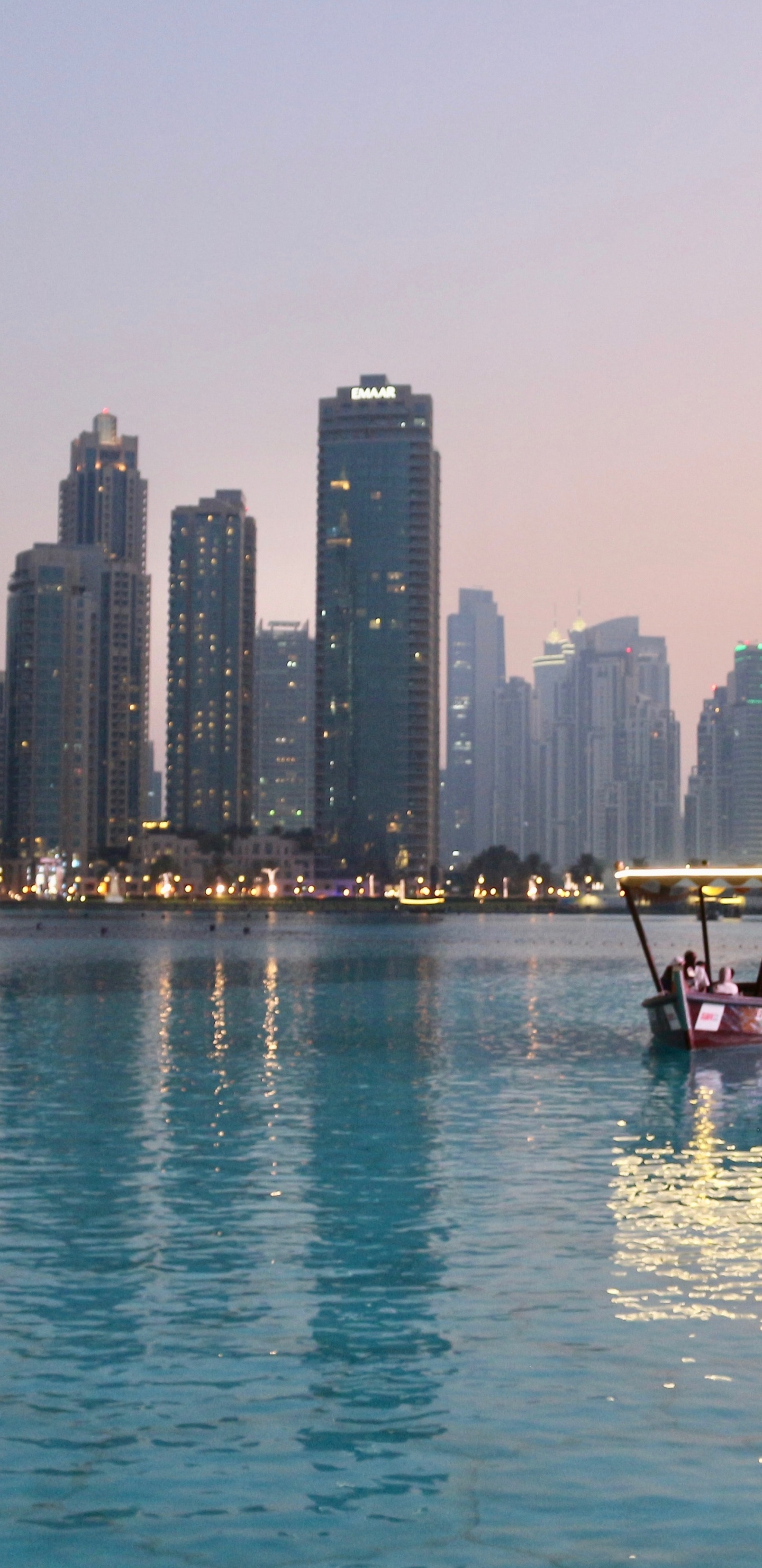 Red Boat on Body of Water Near City Buildings During Daytime. Wallpaper in 1440x2960 Resolution