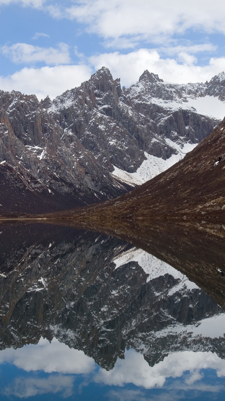 Brown and White Mountains Under White Clouds and Blue Sky During Daytime. Wallpaper in 750x1334 Resolution