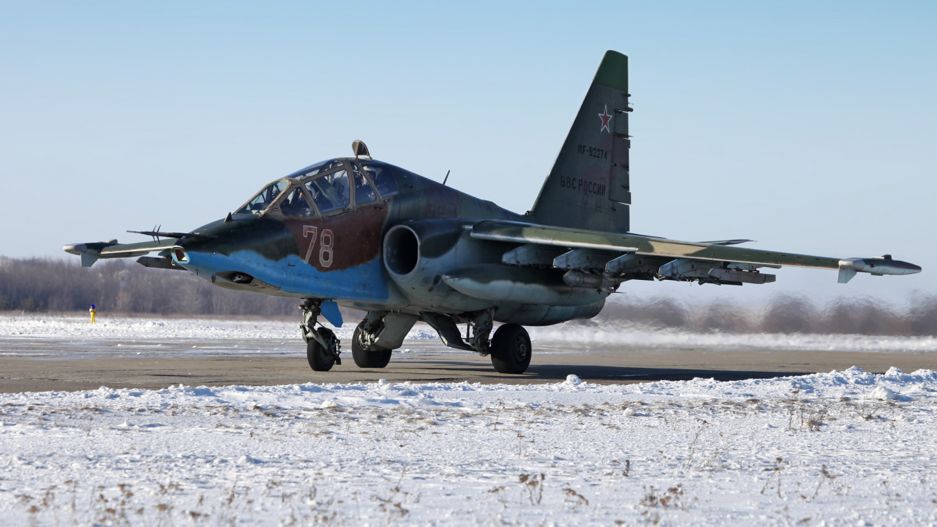 Gray Fighter Plane on White Sand During Daytime. Wallpaper in 1366x768 Resolution