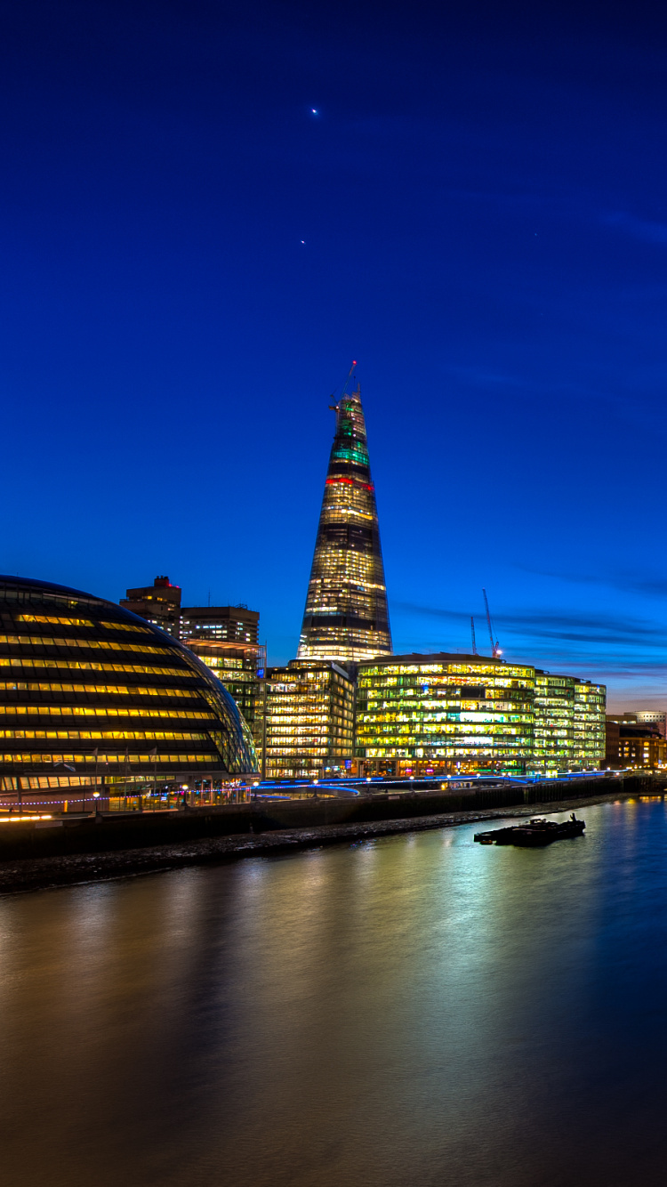 City Skyline Under Blue Sky During Night Time. Wallpaper in 750x1334 Resolution