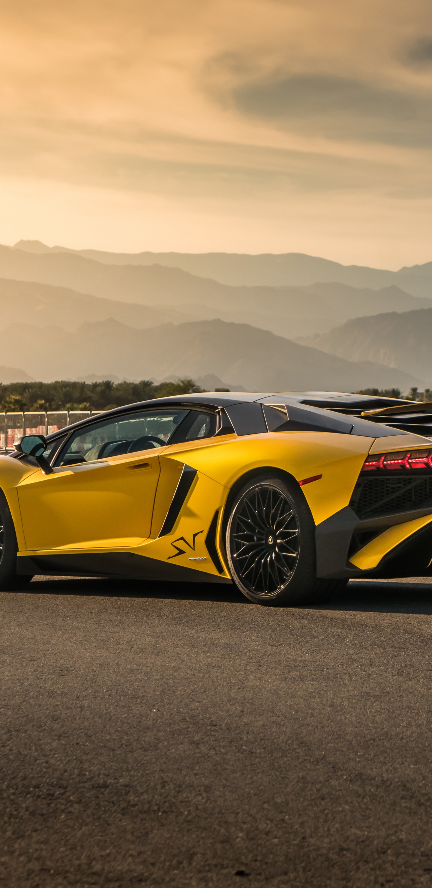 Yellow Porsche 911 on Road Near People Walking on The Street During Daytime. Wallpaper in 1440x2960 Resolution