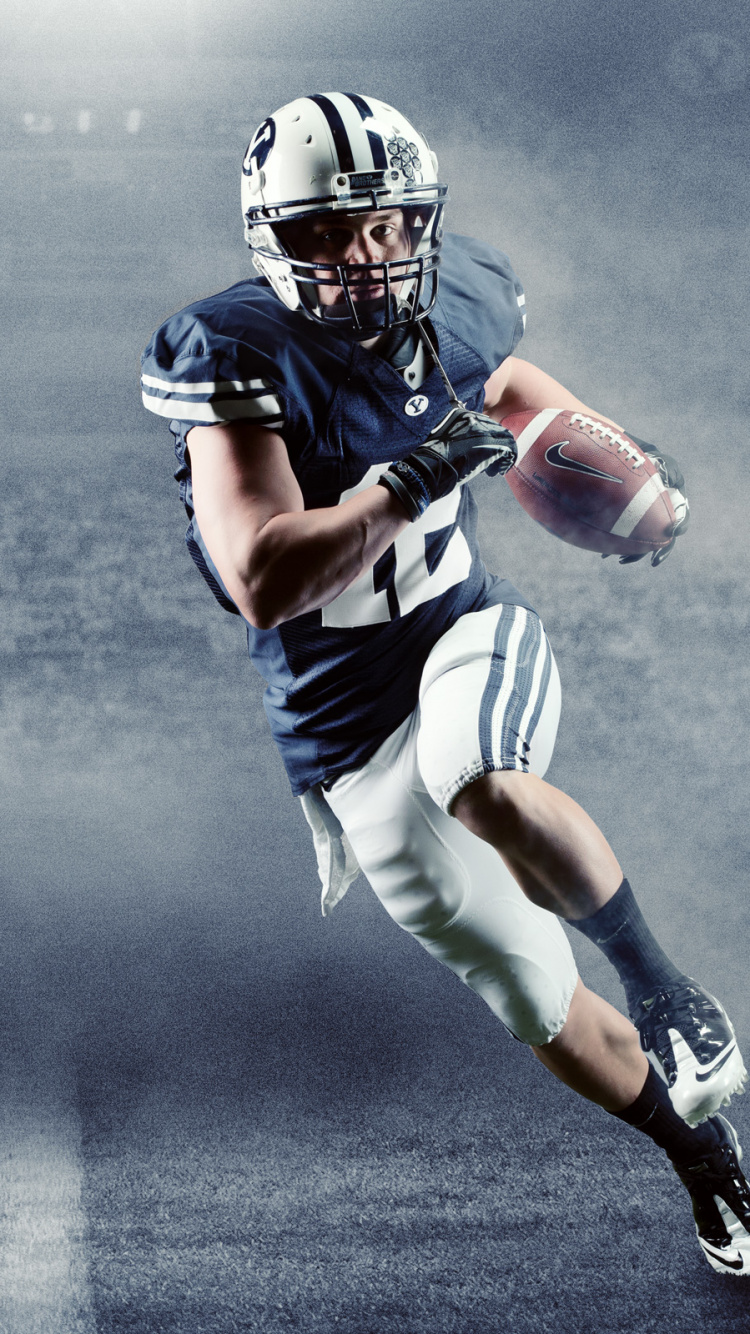 Football Player in Blue and White Jersey Shirt. Wallpaper in 750x1334 Resolution