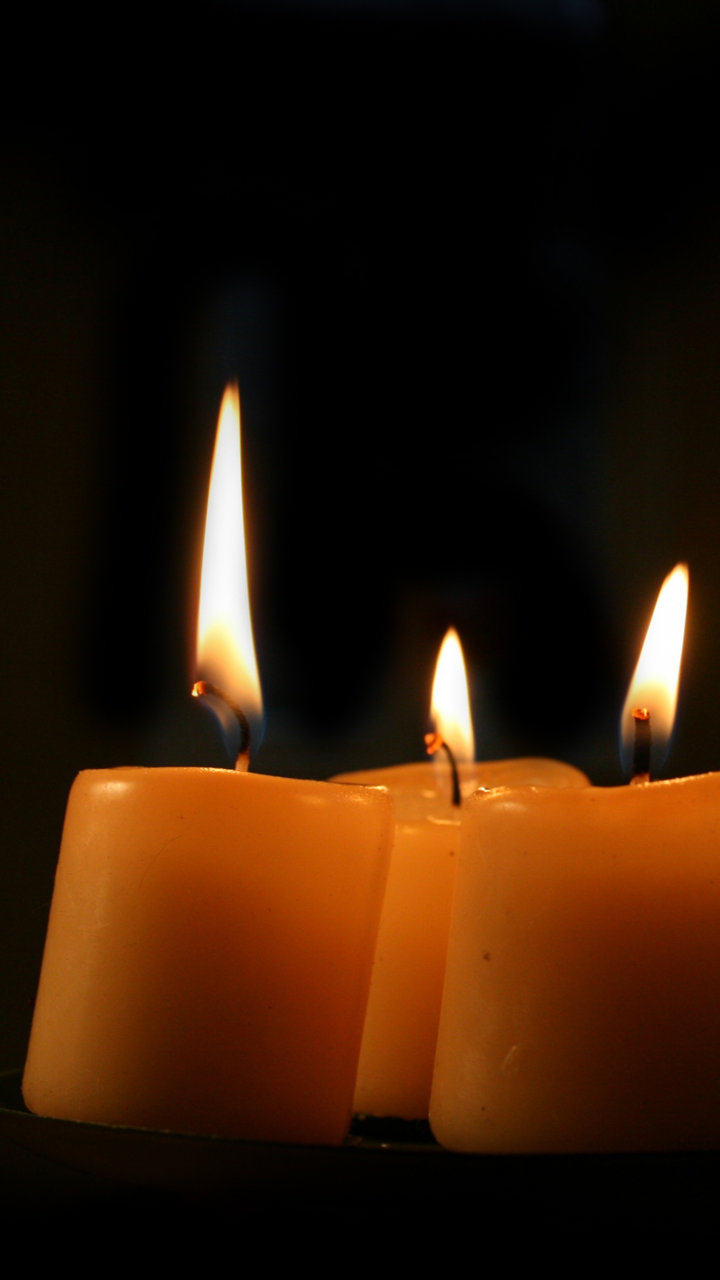 3 Lighted Candles on Black Background. Wallpaper in 1440x2560 Resolution