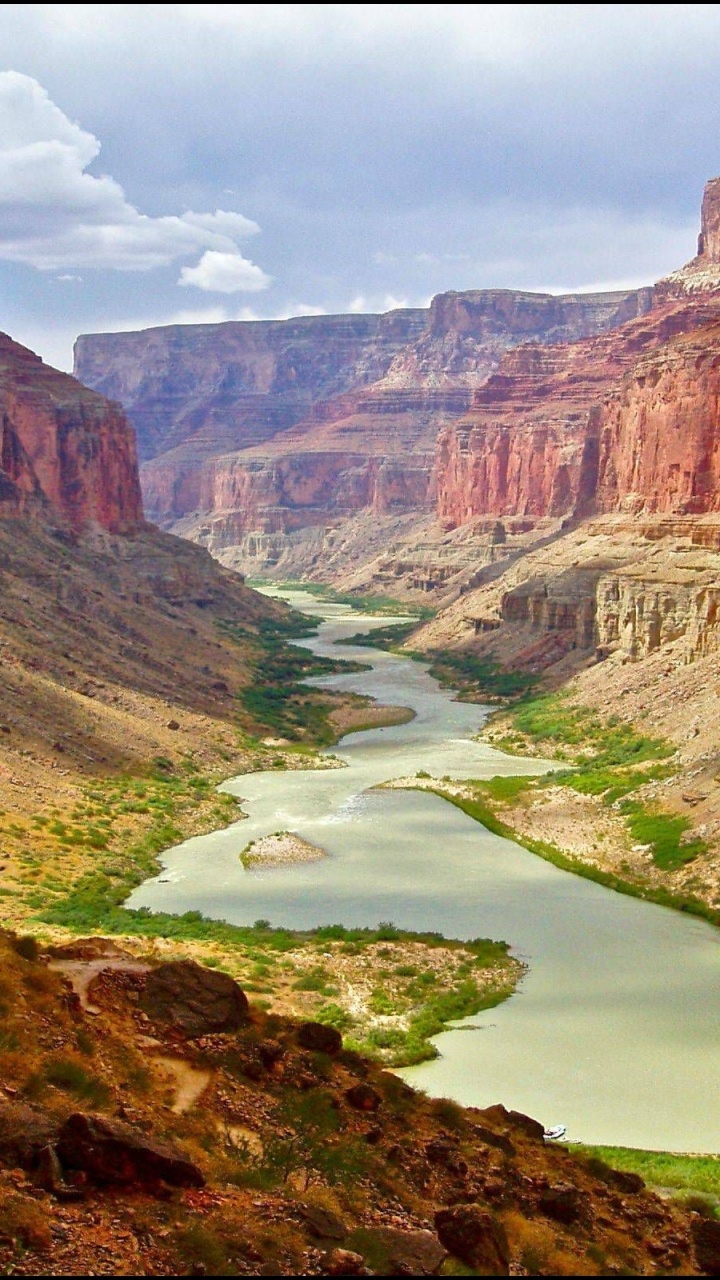 Brown Rocky Mountain With River. Wallpaper in 720x1280 Resolution