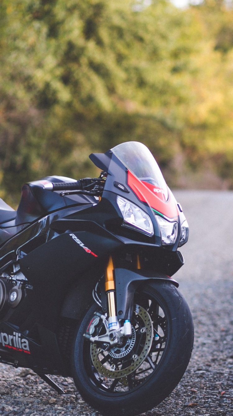 Black and White Sports Bike Parked on The Road During Daytime. Wallpaper in 750x1334 Resolution