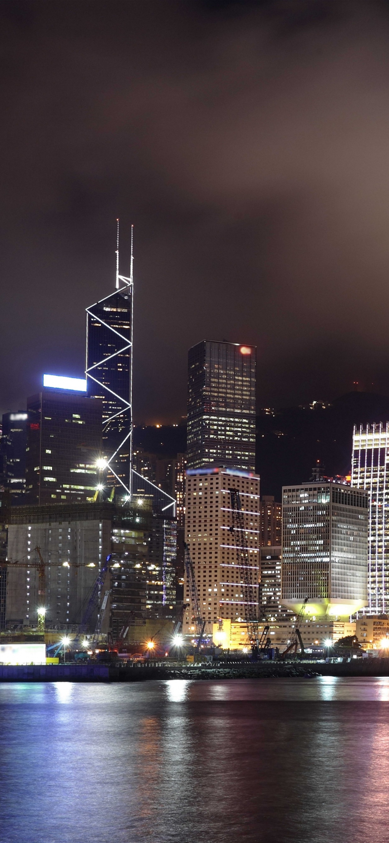 City Skyline During Night Time. Wallpaper in 1242x2688 Resolution