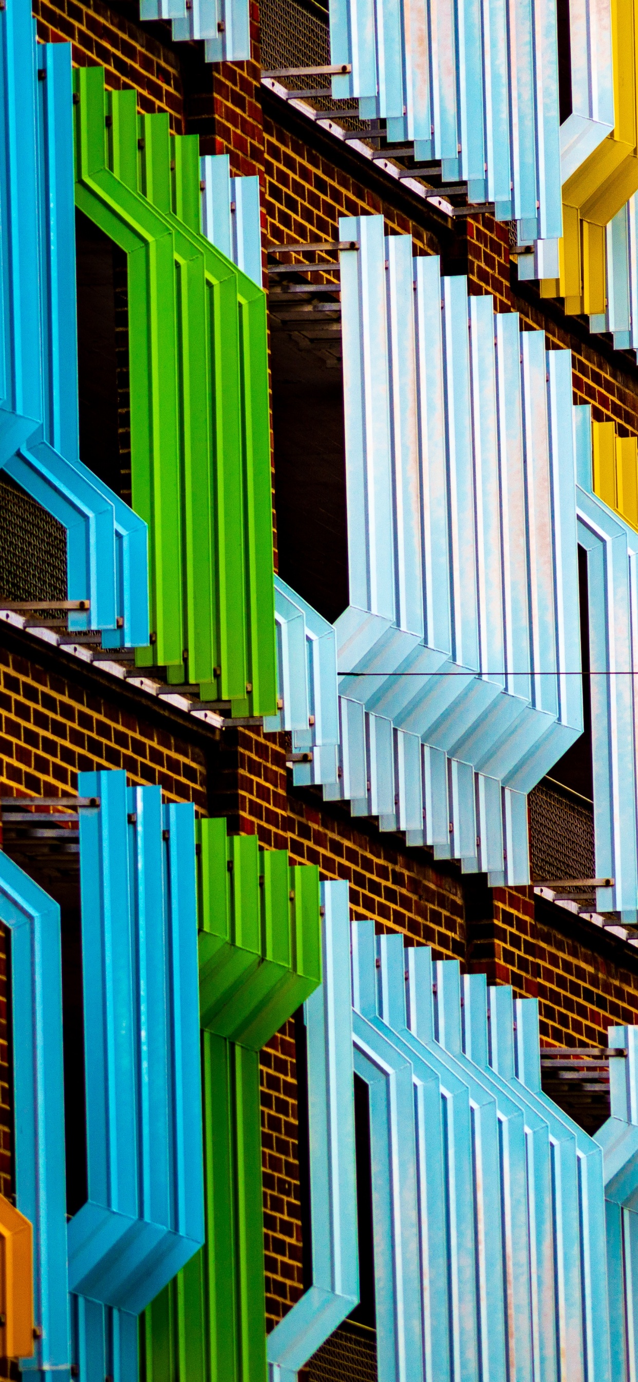 Brown and Green Concrete Building. Wallpaper in 1242x2688 Resolution