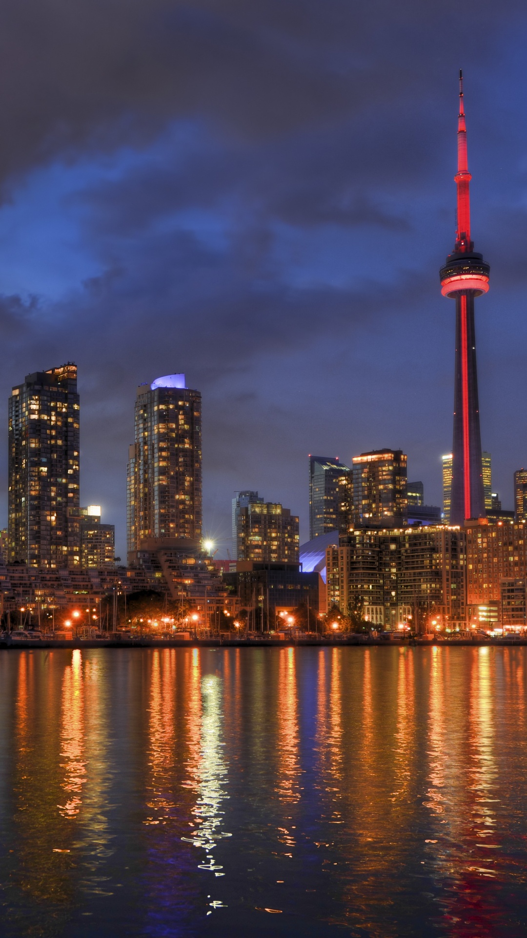 City Skyline Across Body of Water During Night Time. Wallpaper in 1080x1920 Resolution