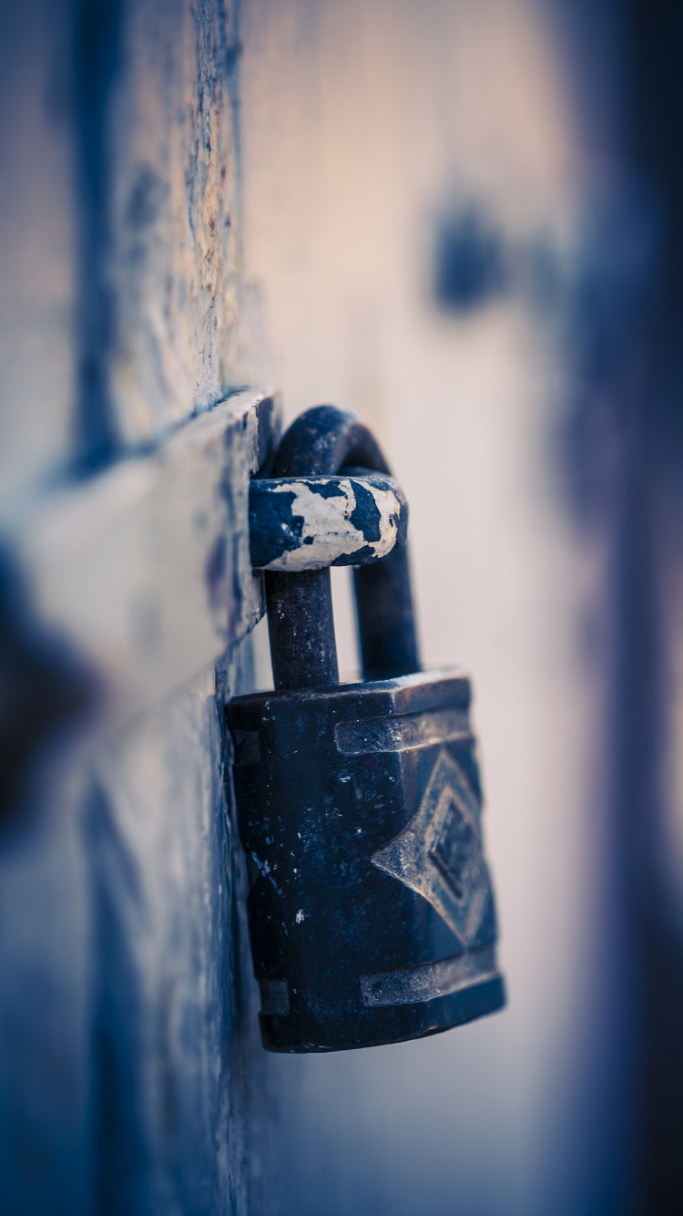 Black Padlock on Blue Metal Fence. Wallpaper in 750x1334 Resolution